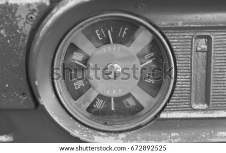 Retro Stained Fuel Gauge in black and white tone.