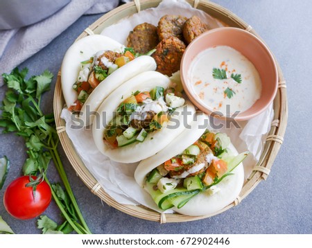 Homemade middle eastern cuisine with shop bought guo bao bun / Steamed Guo Bao with Falafel,Tabouleh Salad and Tahini Sauce / Light and delicious healthy vegetarian meal 