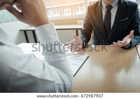 Business - young man explaining about his profile to business managers sitting in job Interview. Royalty-Free Stock Photo #672987907