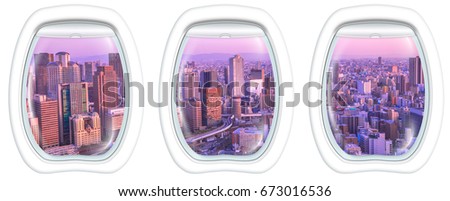 Three porthole frame windows on High-rise buildings in the middle of Osaka with spectacular sunset colors. Umeda district aerial view. Osaka cityscape, Japan.