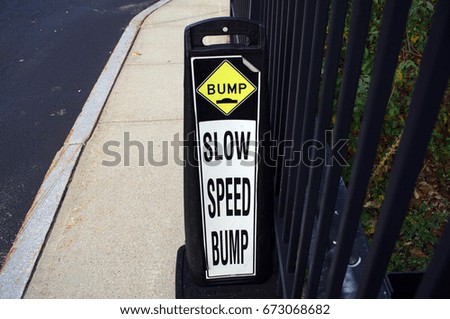 Slow speed bump sign