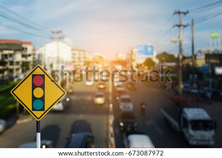 Traffic sign,Traffic lights on Cars on the road bokeh