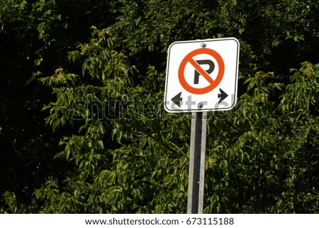 A no parking restriction area is communicated through this street sign.