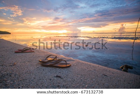 sunset view with golden color and the red slipper 