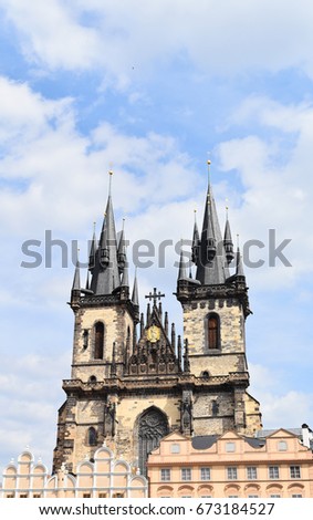 Church of Mother or Our Lady of God before Tyn in the Old Town Square in Prague, Czech Republic, with blue sky and white clouds in the background. Copy space.