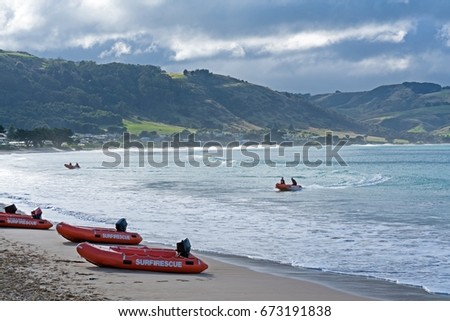 Surf Rescue Rubber Boat on Beach with Seascape and beautiful mountains landscape.