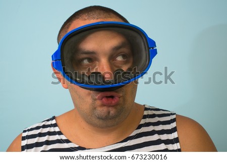 Man in a mask for swimming