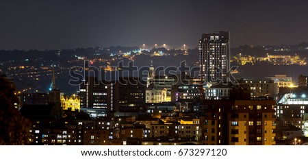 Sheffield city buildings with dramatic hill background Royalty-Free Stock Photo #673297120