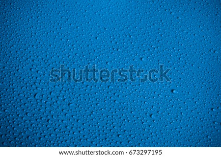 water drops on blue back ground for wallpaper.