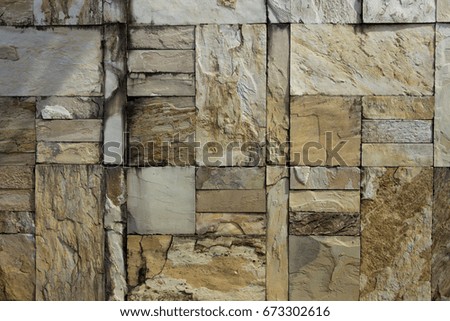 Brown and grey stone tiles wall texture pattern abstract background can be use as wall paper screen saver brochure cover page or for presentation background also have copy space for text.
