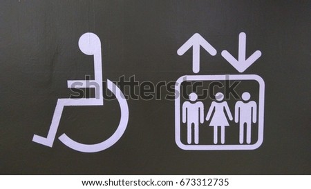Elevator (or lift) and disabled handicap sign.  