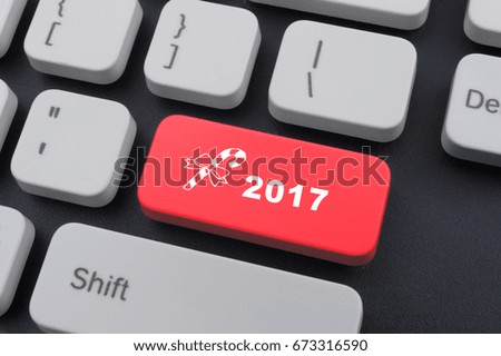 Computer notebook keyboard with 2017 key - holiday technology concept