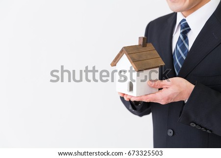 Man having the house of the miniature,  hand