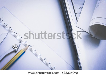 Blue print and plans with drawing compass