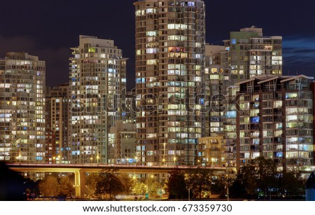 Highrise apartment buildings at night in Vancouver, British Columbia. 