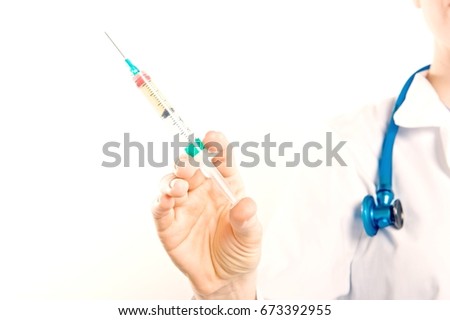 Close up of female nurse hand holding injection isolated over white background