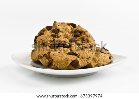 Chocolate cookies on a small dish. Still-life picture taken in studio with white background and soft-box.