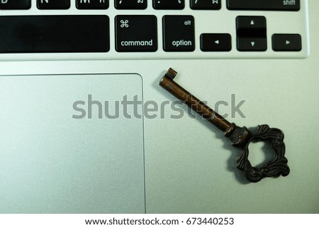 Antique key on laptop