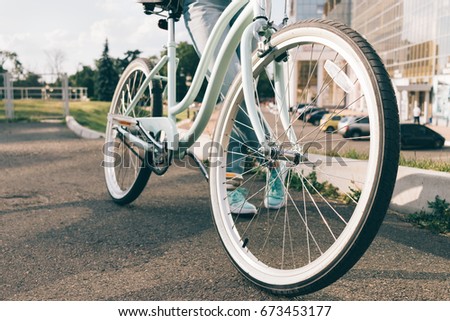 Urban female bicycle in a park in summer close-up