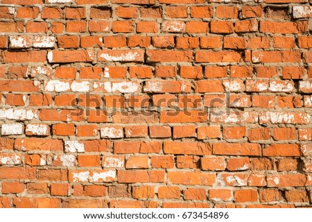 Photo of old red bricks wall. Damaged brick wall.