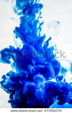 blue ink in water isolated on white background