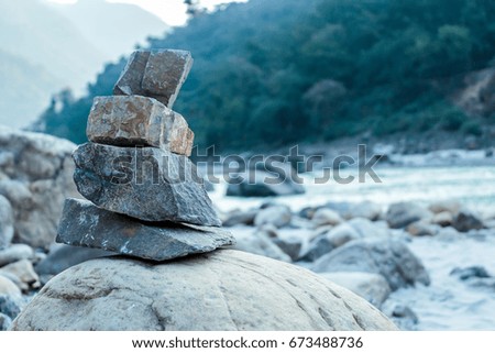 Stack of stones on the shore of ganges river in Rishikesh India
