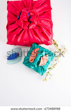 Asian traditional gift box on Silk background and color
