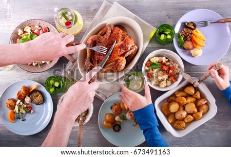 Family dinner. Top view people having dinner together at the rustic wooden table Royalty-Free Stock Photo #673491163