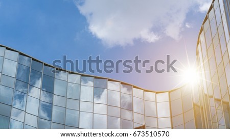 Modern business skyscrapers, high-rise buildings, architecture raising to the sky, sun. Concepts of financial, economics, future etc. Royalty-Free Stock Photo #673510570