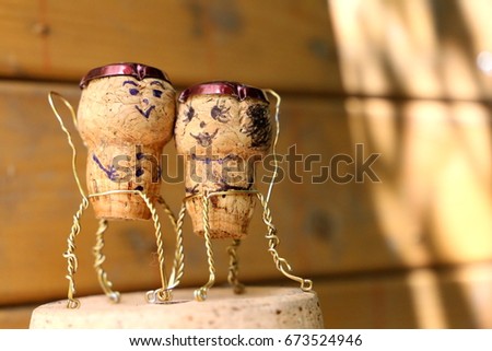 Abstract cork man and woman sitting in chairs Royalty-Free Stock Photo #673524946