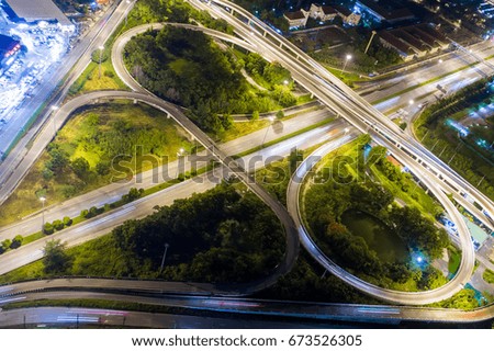 Road beautiful Aerial View of Busy Intersection at Night , top view , thailand .Aerial of Freeway.