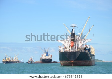 Anchored cargo ship in the morning