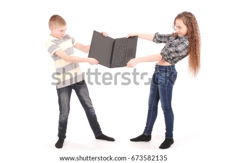 Boy and girl fighting over a laptop, isolated on white 