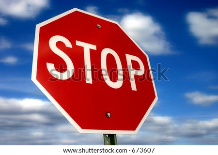 Stop sign against a beautiful sky