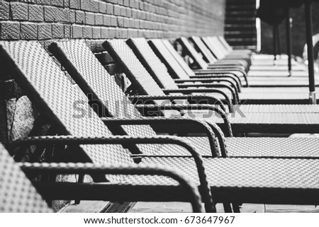 A row of sun beds near the pool