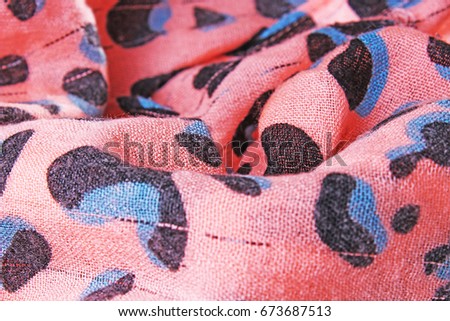 Peach colored scarf closeup texture pattern.