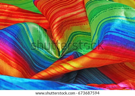Rainbow colored scarf.