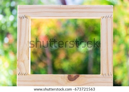  Picture frame on blurred tree backgroud using wallpaper or background for idea work.