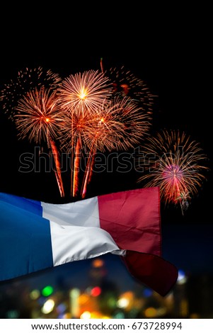 Beautiful holiday fireworks and france flag with (bokek background) blured cityscapes in night La Fete Nationale (Bastille Day) is celebration of french national holiday