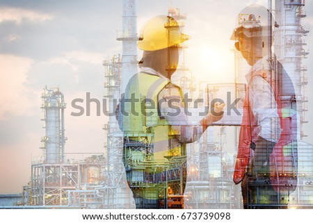 Double exposure of manager and engineer working with safety helmet with oil refinery industry plant background Royalty-Free Stock Photo #673739098