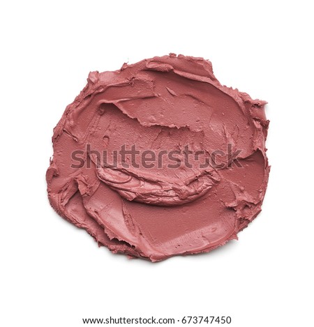 Beige smear of crushed highlighter or luminizer isolated on white background. Makeup smear of creamy lipstic isolated on white background. Creamy lip gloss texture isolated on white background