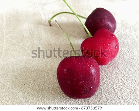 Red cherry on the brown canvas floor so beautiful