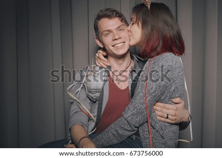 Happy couple in love in a photo booth