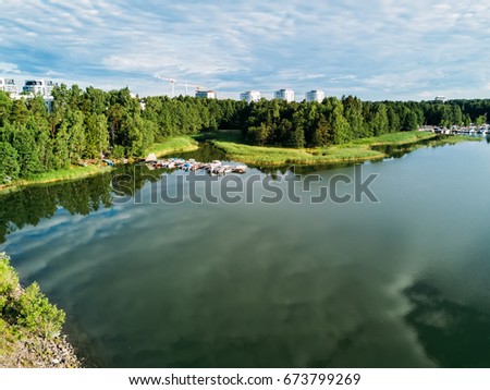 Aerial view of Beautiful reflections in a bay with boats and boats