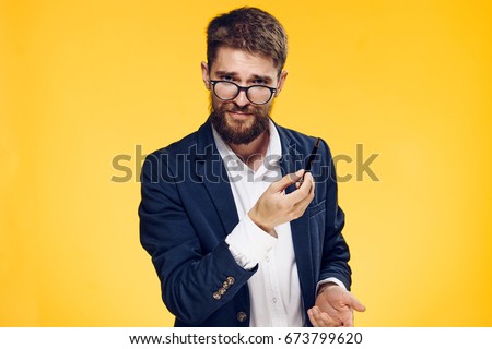  Business man on a yellow background                              
