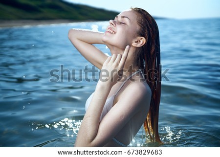A woman on the sea is floating                               