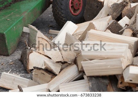 on a very sunny day in july in south germany you see stove wood single and assorted on a pile