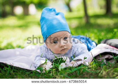 Little child on green grass