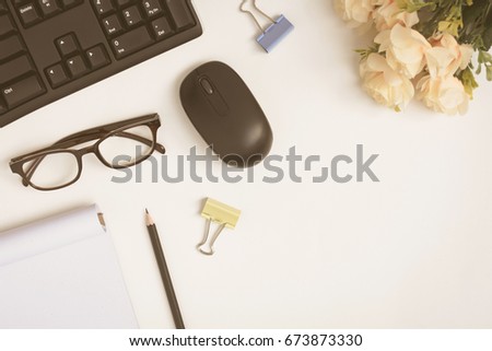 Office equipment on the wood desk with business workspace and vintage tone