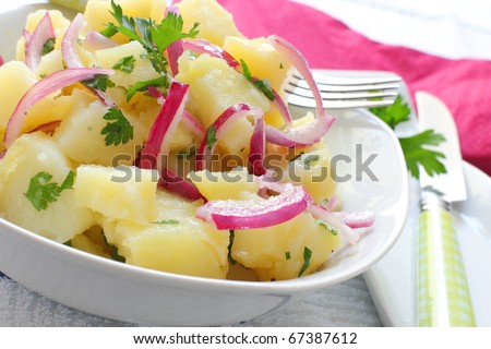 fresh potato salad with onion and parsley Royalty-Free Stock Photo #67387612